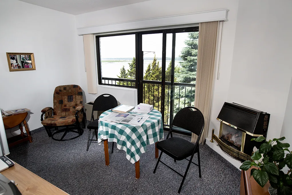 The Suite/Studio with Ottawa River View — a split suite with balcony doors facing the river