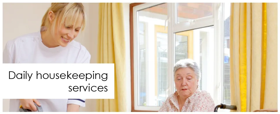 Daily housekeeping services — staff tidying a resident's room