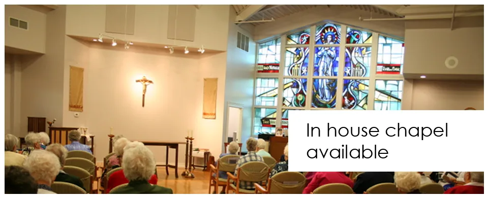 In-house chapel available — residents gathered in the chapel with its stained glass window