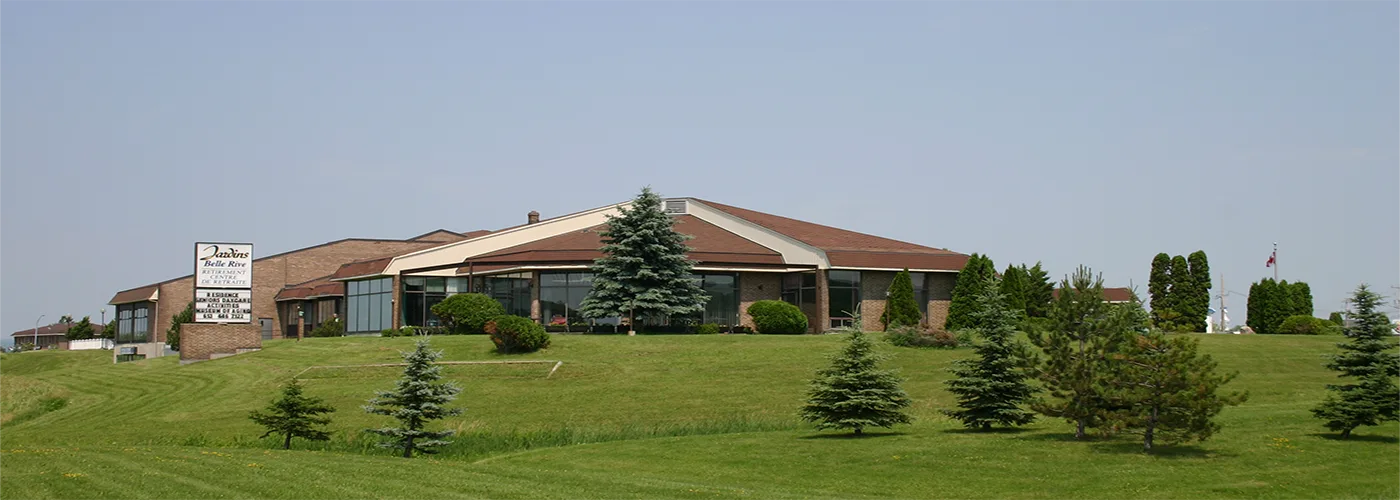 Jardins Belle Rive seen from the road, on its green hill